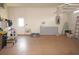 Spacious two car garage featuring abundant storage space, shelving, and access door at 3398 Tripoli Blvd, Punta Gorda, FL 33950