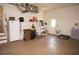 A two car garage with a refrigerator and other storage options, as well as an access door to the backyard at 3398 Tripoli Blvd, Punta Gorda, FL 33950