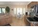 Charming kitchen area with stainless steel appliances, custom backsplash, and breakfast nook with bay windows at 3398 Tripoli Blvd, Punta Gorda, FL 33950