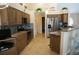 Beautiful kitchen features custom wood cabinets, granite counters, tiled backsplash, and modern appliances at 3398 Tripoli Blvd, Punta Gorda, FL 33950