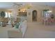 Open-concept living area featuring plush seating and views of the kitchen and dining room at 3398 Tripoli Blvd, Punta Gorda, FL 33950