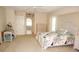 Spacious main bedroom featuring large windows, neutral walls and carpet at 3398 Tripoli Blvd, Punta Gorda, FL 33950