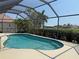 A sparkling screened-in pool offers a private oasis for relaxation and recreation on a sunny day at 3398 Tripoli Blvd, Punta Gorda, FL 33950