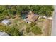 Aerial view of the property featuring a screened in pool, storage shed and mature trees at 4071 Dekle Ave, North Port, FL 34286