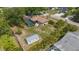 Aerial view of the home with a screened in pool and storage shed at 4071 Dekle Ave, North Port, FL 34286