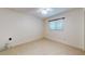 Bedroom has tiled floors, neutral-colored walls, and a large window at 4071 Dekle Ave, North Port, FL 34286