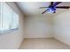 Bedroom features large window and neutral walls with tiled floors at 4071 Dekle Ave, North Port, FL 34286