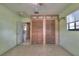 Bedroom features a ceiling fan and a double closet with shutter style doors at 4071 Dekle Ave, North Port, FL 34286