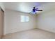 Bedroom has tiled floors, neutral-colored walls, and a large window at 4071 Dekle Ave, North Port, FL 34286