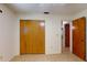 Bedroom has wood closet doors, neutral-colored walls and tiled floors at 4071 Dekle Ave, North Port, FL 34286