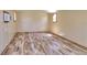 Shed with woodgrain flooring and two windows for natural light; a blank canvas for storage at 4071 Dekle Ave, North Port, FL 34286