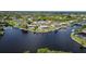 Stunning aerial view showcasing waterfront homes and a tranquil waterway at 4216 Bur St, Port Charlotte, FL 33948