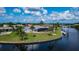 Waterfront property showcasing a private dock and screened-in pool at 4216 Bur St, Port Charlotte, FL 33948