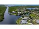 Aerial view of waterfront homes with backyard pools and docks at 4216 Bur St, Port Charlotte, FL 33948