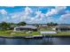Aerial view of a waterfront house with private dock and pool at 4216 Bur St, Port Charlotte, FL 33948