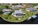 Gorgeous aerial view of waterfront property with pool, dock, and boat lift at 4216 Bur St, Port Charlotte, FL 33948
