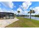 Beautiful backyard with screened in pool and waterfront access at 4216 Bur St, Port Charlotte, FL 33948