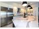 Modern kitchen featuring stainless steel appliances, white cabinets, and quartz countertops at 4216 Bur St, Port Charlotte, FL 33948