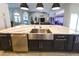 Spacious kitchen island with sink, stainless steel appliances, and open layout to living area at 4216 Bur St, Port Charlotte, FL 33948