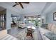 Bright living room featuring tile floors, large windows with water views and comfortable seating at 4216 Bur St, Port Charlotte, FL 33948