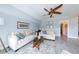 Bright living room boasts stylish furnishings, wood-look floors, and a comfortable seating arrangement at 4216 Bur St, Port Charlotte, FL 33948