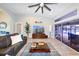 Inviting living area featuring stylish furniture, recessed lighting, and a seamless transition to outdoor living at 4216 Bur St, Port Charlotte, FL 33948