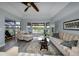 Cozy living room features comfortable seating, natural light, and views of the waterfront at 4216 Bur St, Port Charlotte, FL 33948