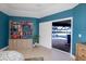 Main bedroom with beautiful bookshelf and outdoor view to the pool at 4216 Bur St, Port Charlotte, FL 33948