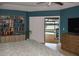 Comfortable main bedroom with view of outdoor pool and water access, featuring a bookshelf at 4216 Bur St, Port Charlotte, FL 33948