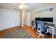 Functional home office with hardwood floors, a ceiling fan, and a large closet at 4216 Bur St, Port Charlotte, FL 33948