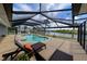 The home features a screened pool with plenty of room for lounge chairs and entertaining at 4216 Bur St, Port Charlotte, FL 33948