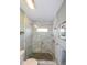 This bathroom features a shower with marble tiling and a pebble floor at 4216 Bur St, Port Charlotte, FL 33948