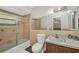 The bathroom includes a shower with sliding glass door, toilet, mirror, and small sink with vanity at 426 Burland St, Punta Gorda, FL 33950