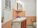 Bathroom featuring a tiled wall, vanity sink, and updated fixtures at 426 Burland St, Punta Gorda, FL 33950