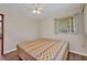 Cozy bedroom with neutral walls, a ceiling fan, and natural light from a window at 426 Burland St, Punta Gorda, FL 33950