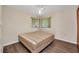 Simple bedroom featuring a large bed, two windows, and a ceiling fan at 426 Burland St, Punta Gorda, FL 33950