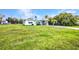 Charming single-story home surrounded by lush greenery and a well-maintained lawn at 426 Burland St, Punta Gorda, FL 33950