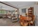 Open-concept living and dining area featuring hardwood floors and cozy seating at 426 Burland St, Punta Gorda, FL 33950