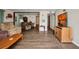 Comfortable living room featuring wood-look floors, neutral walls, and relaxed seating at 426 Burland St, Punta Gorda, FL 33950