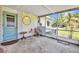 View of the screened-in porch featuring tiled flooring and outdoor seating with a view of the yard at 426 Burland St, Punta Gorda, FL 33950