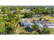 Aerial view of a cozy home with a refreshing pool and trampoline in the backyard at 4702 Westwood Dr, Punta Gorda, FL 33982