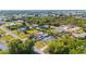Aerial view of a charming neighborhood with lush trees, cozy homes, and a tranquil vibe at 4702 Westwood Dr, Punta Gorda, FL 33982