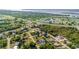 An aerial view of a community with lush greenery, highways, water views, and diverse housing options at 4702 Westwood Dr, Punta Gorda, FL 33982