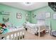 Bright bedroom featuring two twin beds, soft carpet, plenty of natural light, and nice decor at 4702 Westwood Dr, Punta Gorda, FL 33982