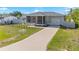 Charming single-story home with a screened porch, driveway and fenced front yard at 4702 Westwood Dr, Punta Gorda, FL 33982