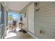 Inviting front porch with rocking chair, creating a cozy and welcoming entrance to the home at 4702 Westwood Dr, Punta Gorda, FL 33982