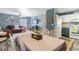 Open-concept living space combines living, dining, and kitchen areas with wood look floors and modern decor at 4702 Westwood Dr, Punta Gorda, FL 33982