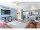 Open-concept living space combines living, dining, and kitchen areas with wood look floors and modern decor at 4702 Westwood Dr, Punta Gorda, FL 33982