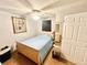 Small bedroom with white walls, tile floors, a bed, and a ceiling fan at 481 Reading Nw St, Port Charlotte, FL 33952