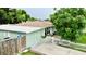 Charming home with a well-maintained yard, white picket fence, and a lovely painted pelican on the shed at 481 Reading Nw St, Port Charlotte, FL 33952